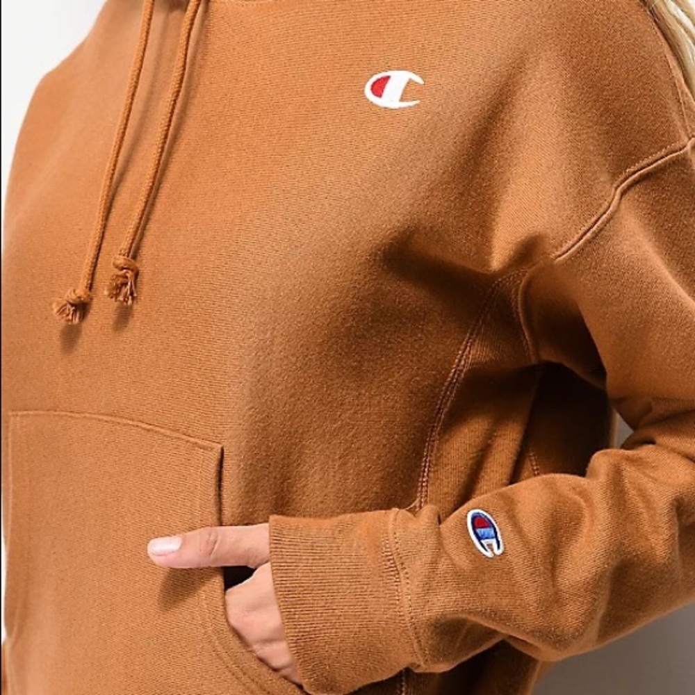 small woman’s orange champion hoodie